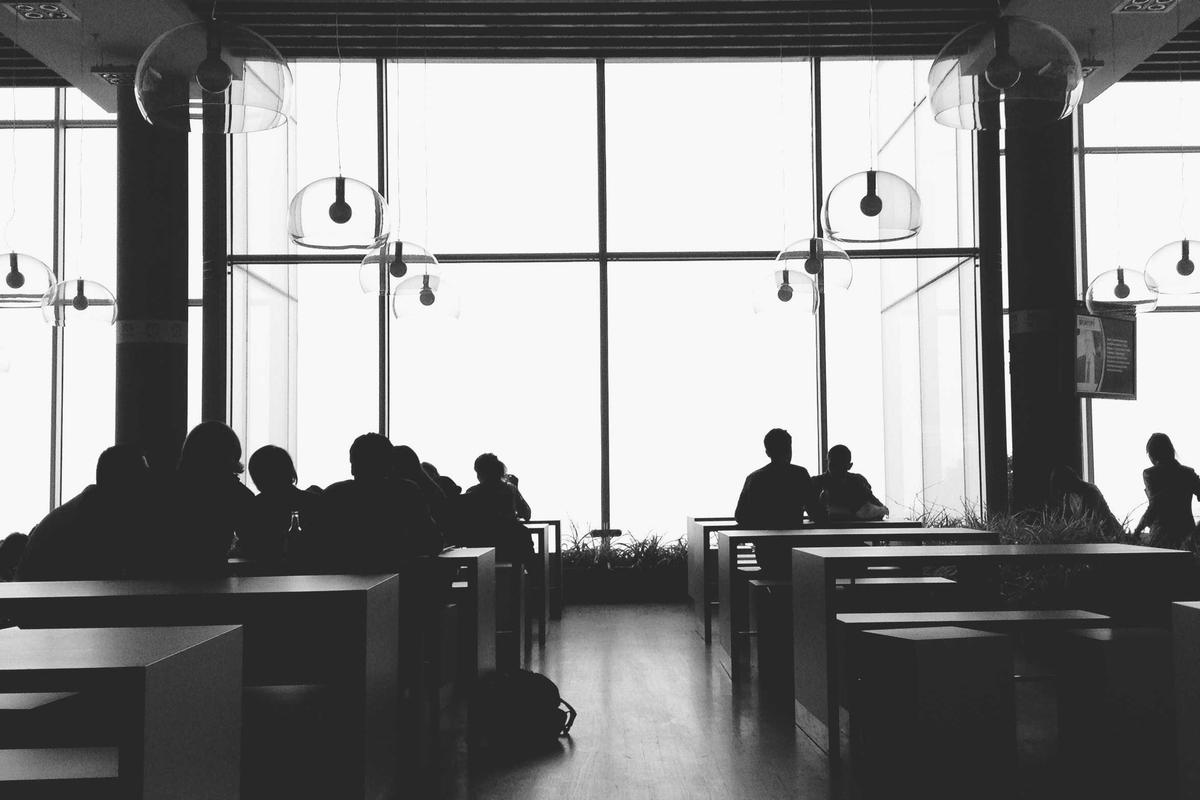 Business professionals network at modular conference booth display